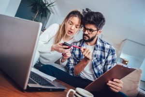 man and woman figuring out taxes