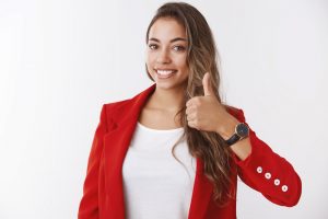 Girl assuring you have lucky day. Happy smiling gorgeous female entrepreneur showing thumb up, liking approving awesome idea delighted giving positive reply, agree, standing white background