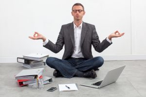 peaceful entrepreneur practicing yoga, seeking for inspiration