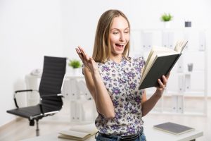 Excited female with notepad