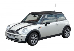 White mini car in retro style with black sport stripes isolated on white with clipping path