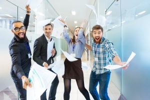 excited workers in an office