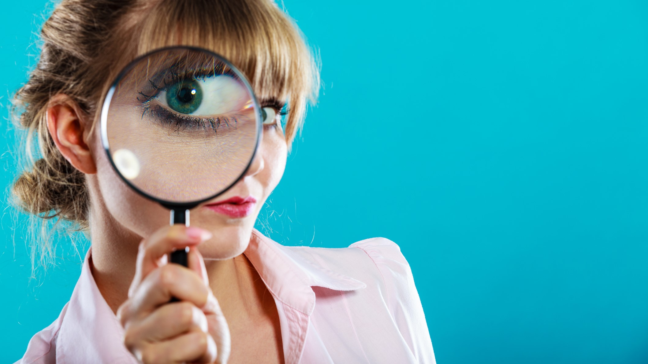 woman using magnifying glass dreamstime_m_59993703 (2) Job Crusher